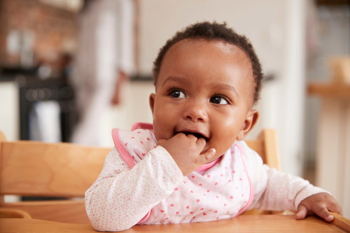Infant program Baby laying on carpet
